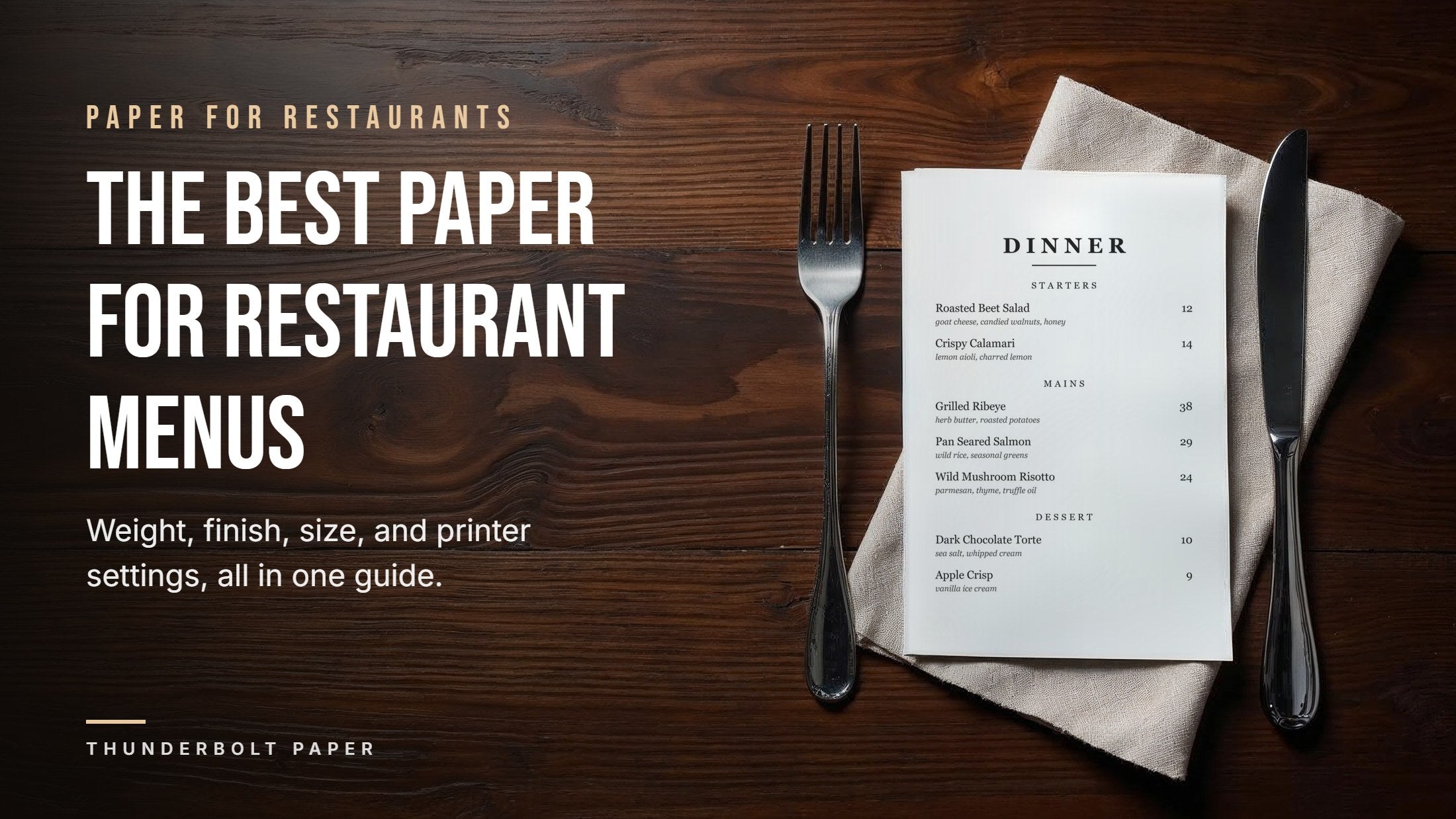 Printed dinner menu on white cardstock beside a fork and knife on a wooden restaurant table